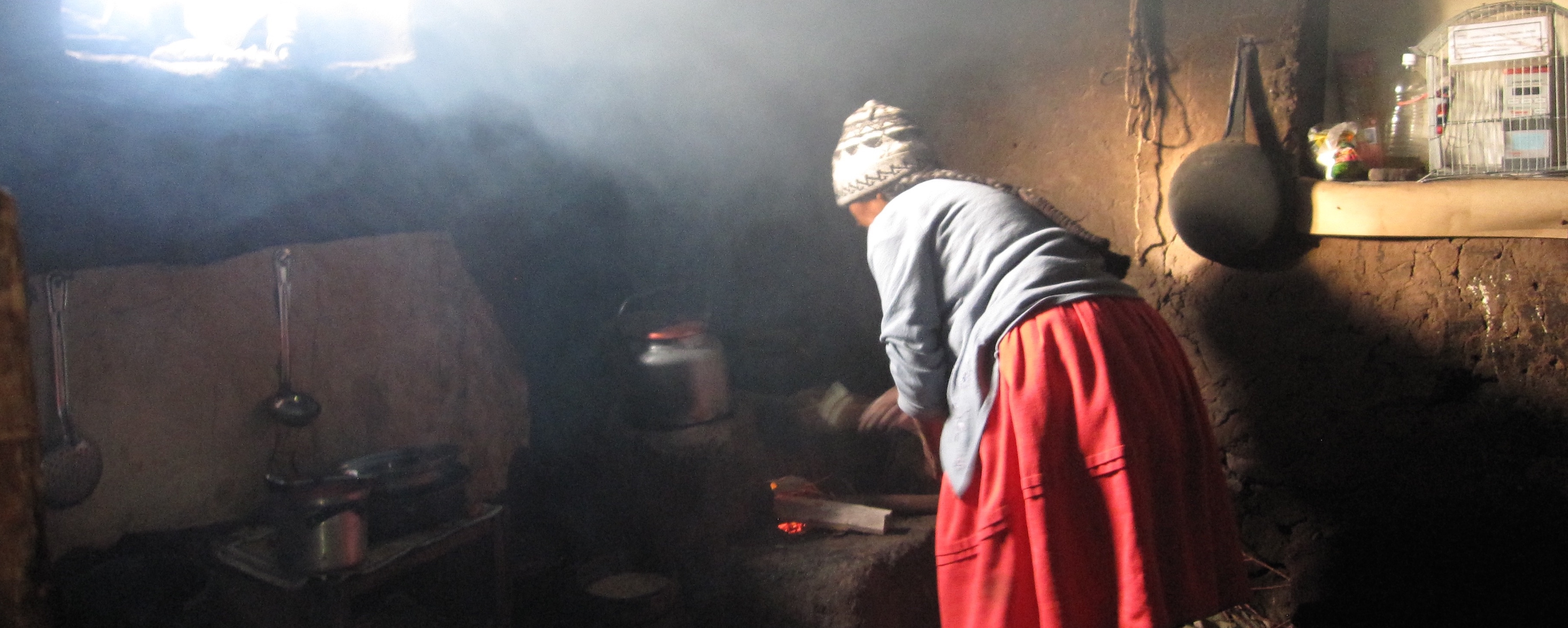Woman cooking on traditional indoor stove